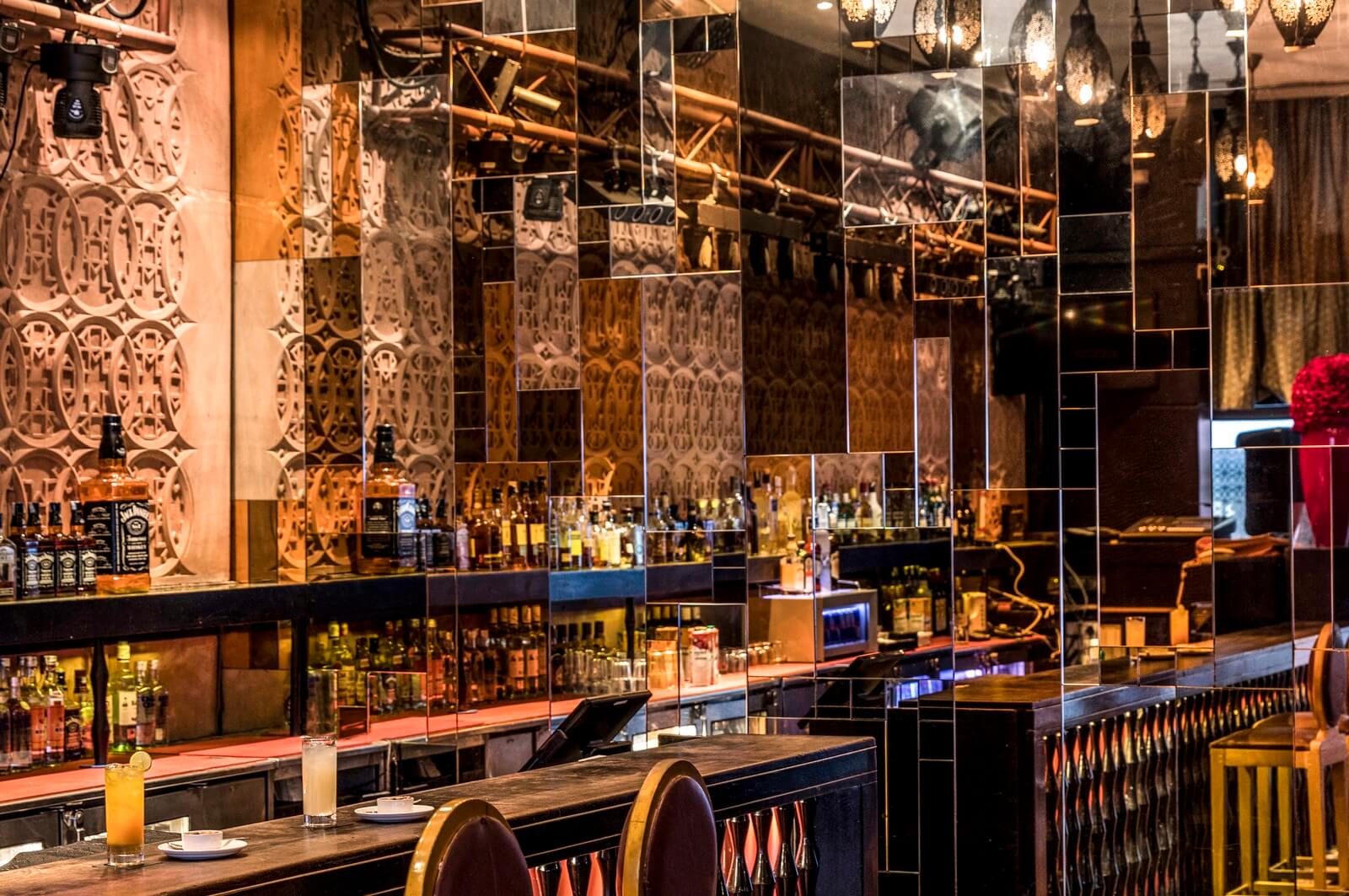 The Interior of the indoor bar arranged with a dining setup at The Park Bangalore