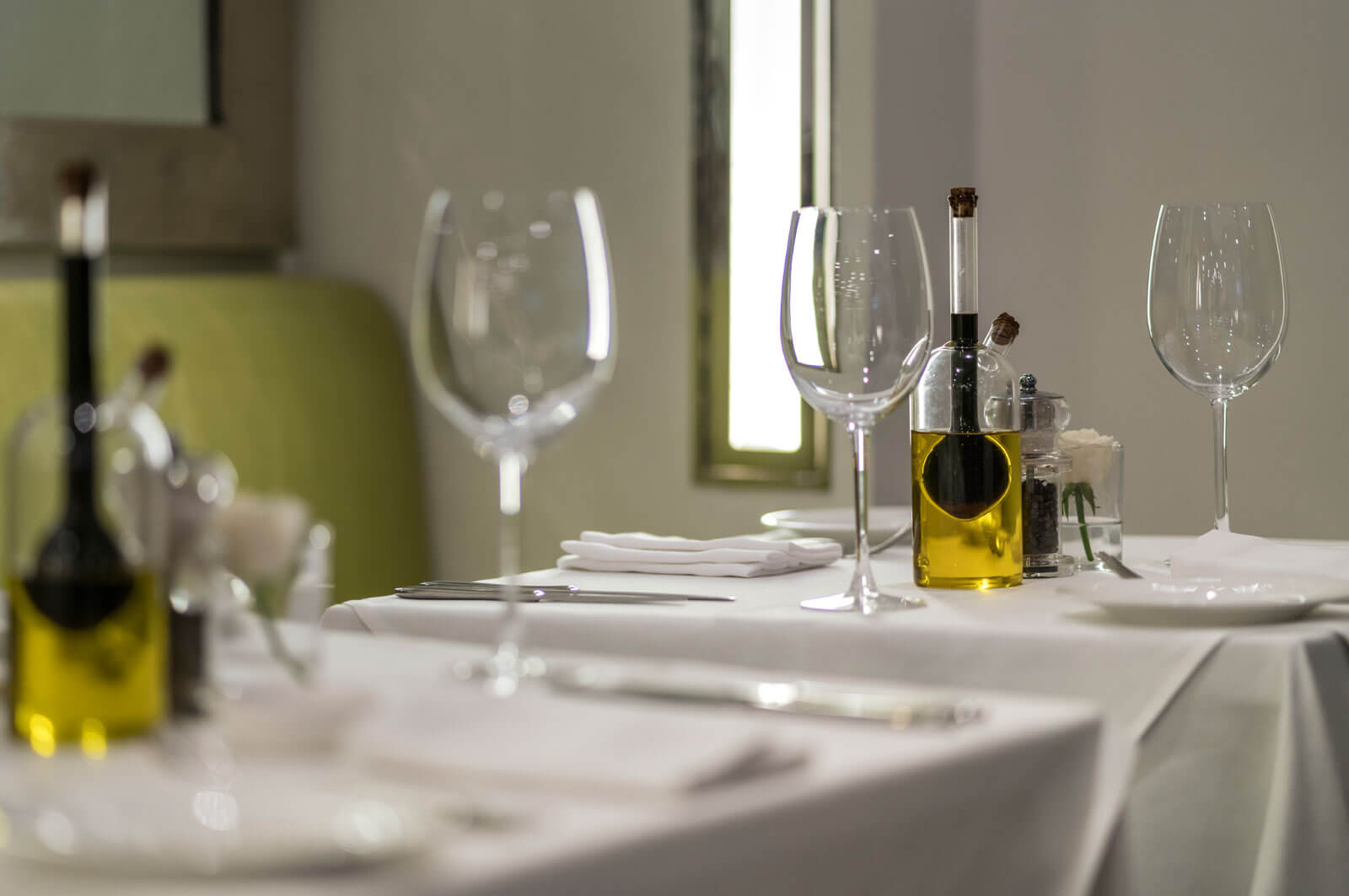 Wine Glass with Wine Bottles at The Park Hotels Bangalore