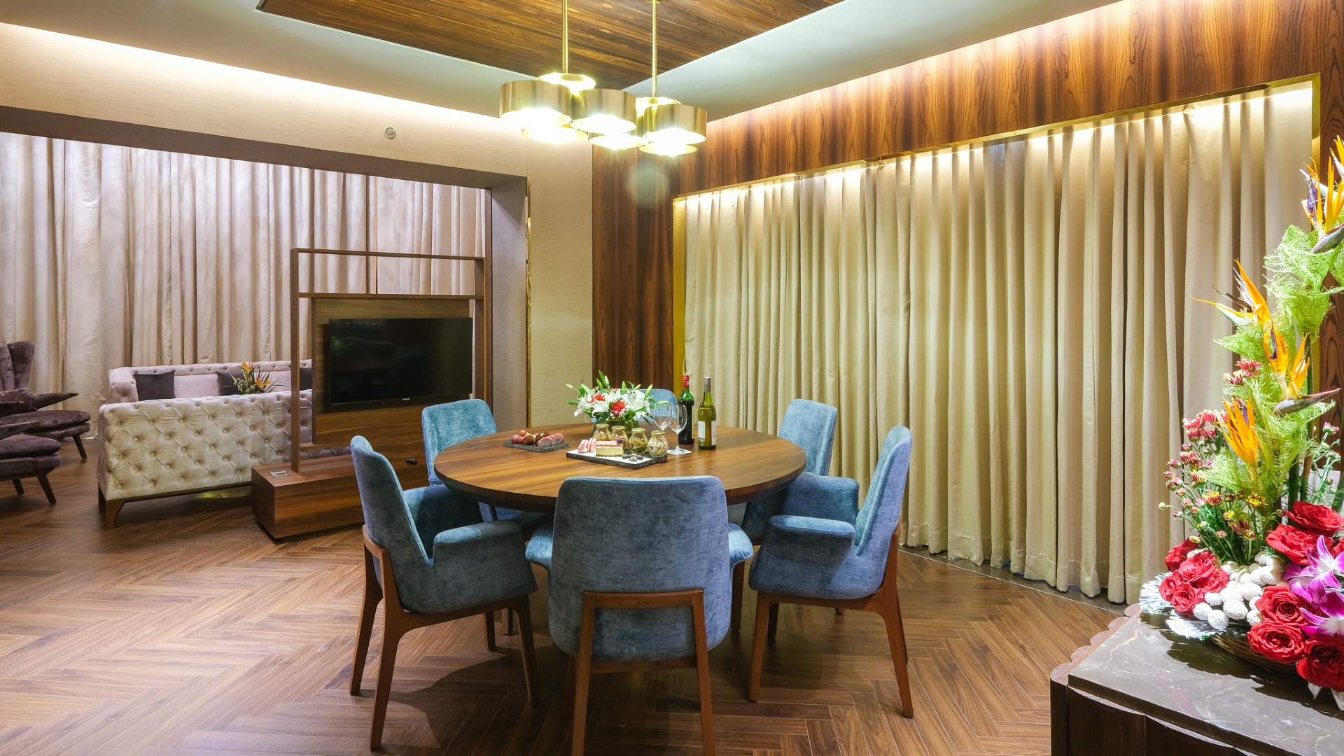 Dining table set up with living area in Presidential Suite