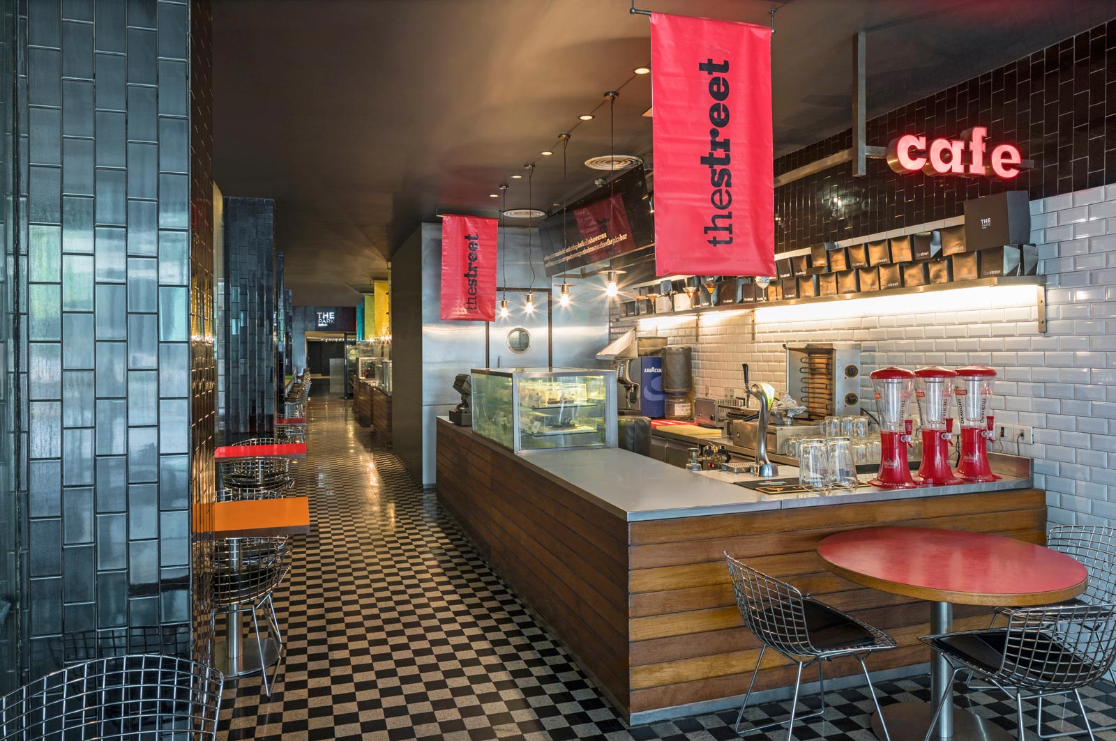 Interior of street cafe with dining table set up at The Park Hotel Kolkata