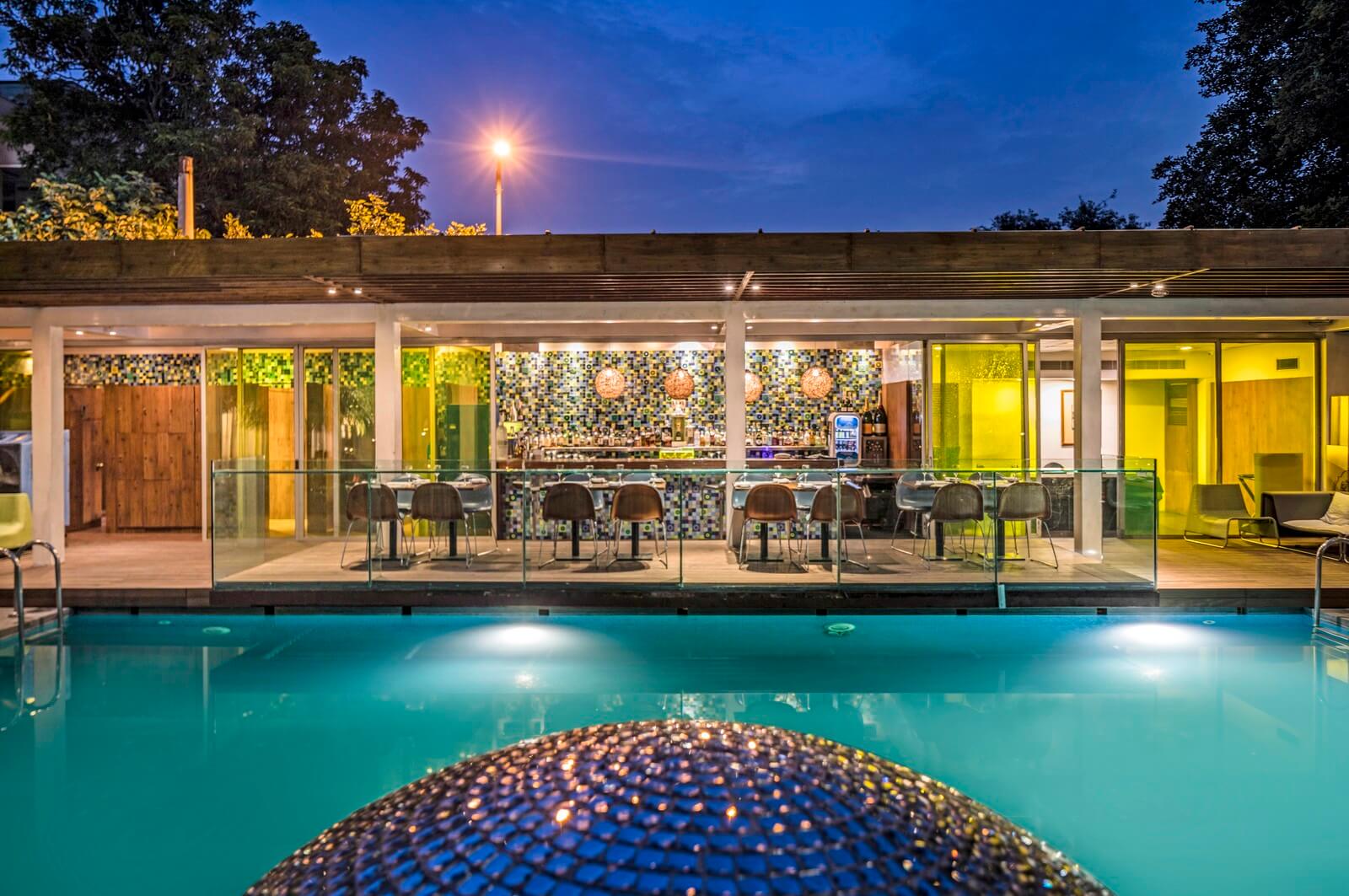 Bar with Seating Area and Outdoor Pool at Aqua, The park New Delhi