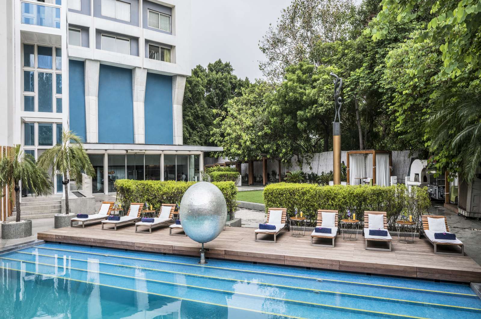 Outdoor Pool with Sunbeds at Aqua, The park New Delhi