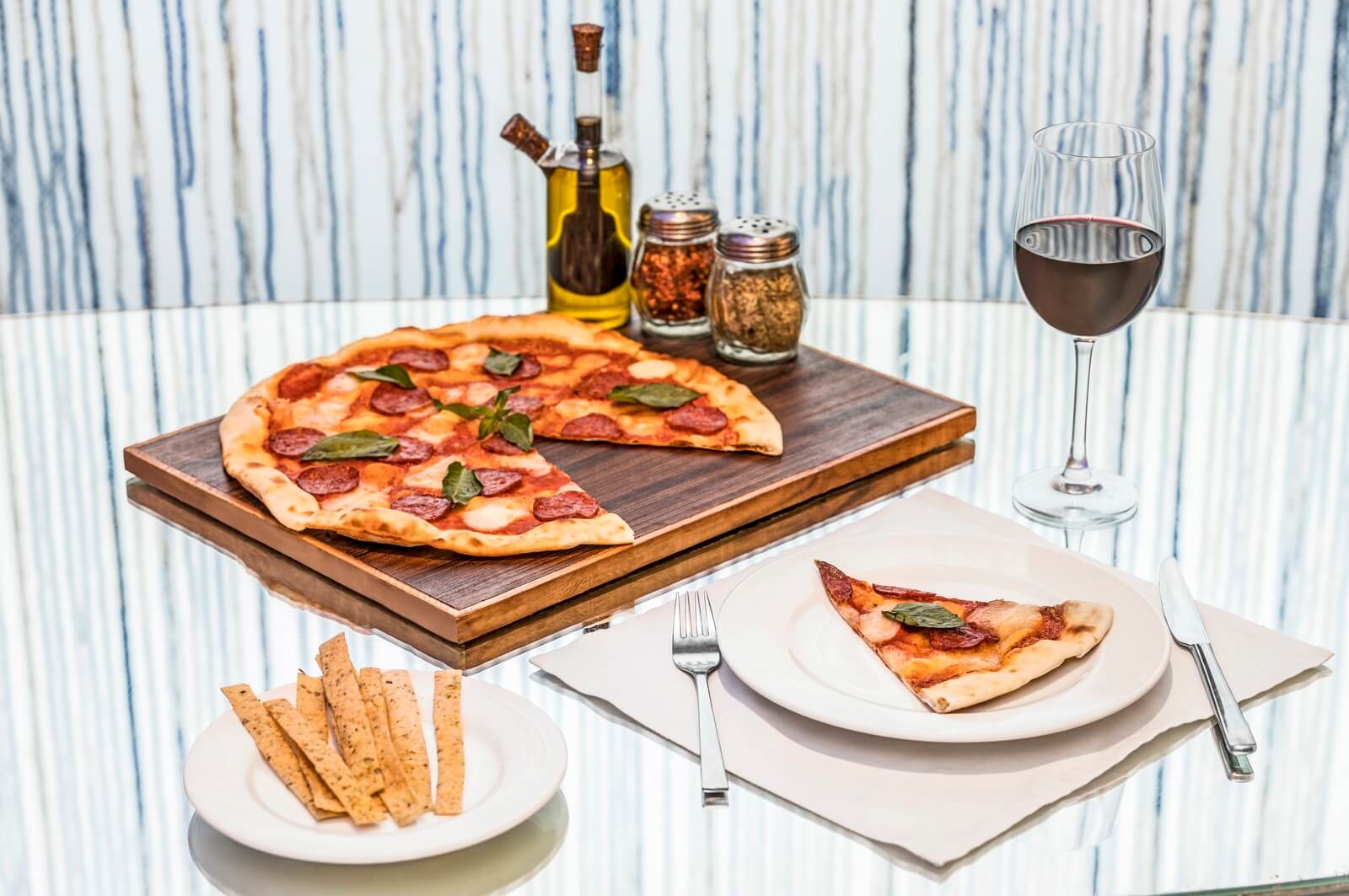 Pizza Served with Spices and Wine at Mist Resort