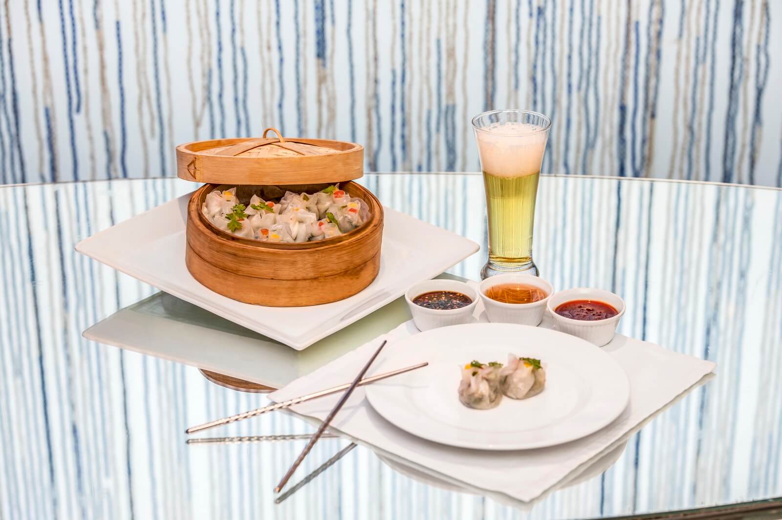 Delicious Traditional Asian Dim sum Dishes in wooden bowls