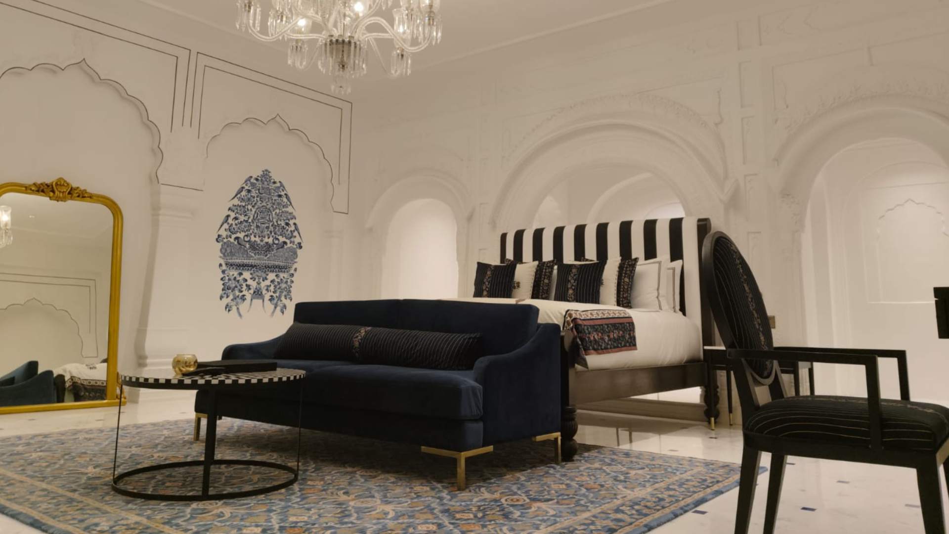 Bed bench beside the king bed in the Deluxe Suite at Raan Bass The Palace