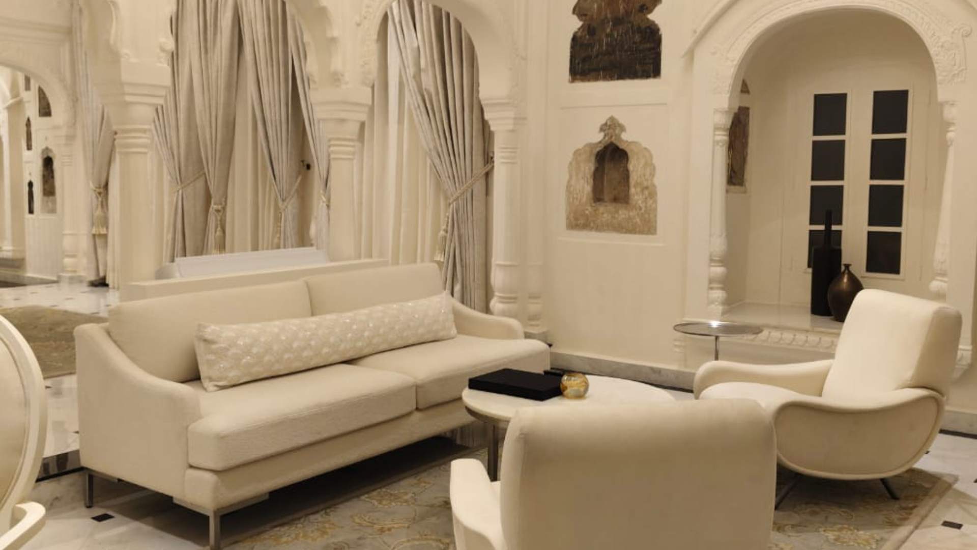 White-themed sofa in the Luxury Suite at Raan Baas The Palace