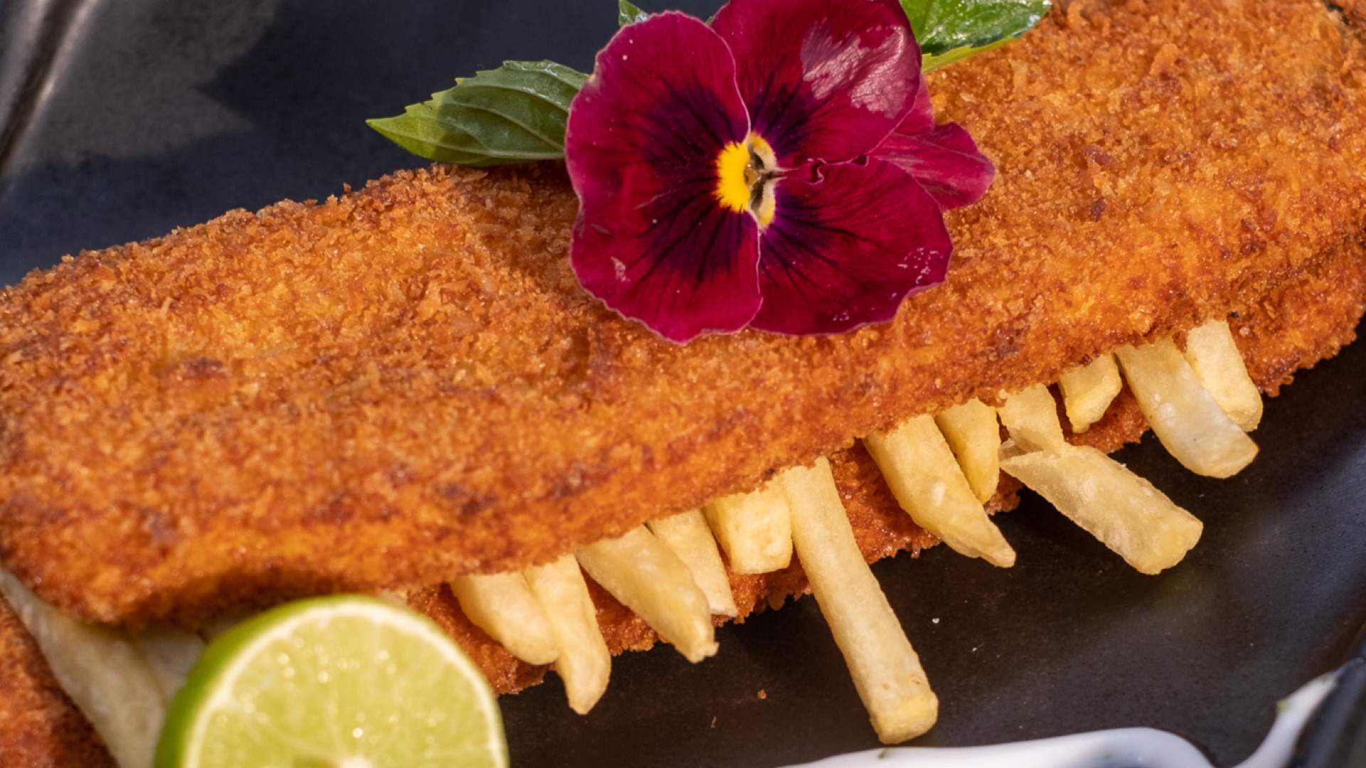 Closeup of Crispy Fish and Chips served with lemon at The Denmark Tavern